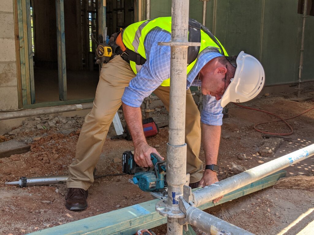 Andrew Wallace MP working on a building site as a carpenter